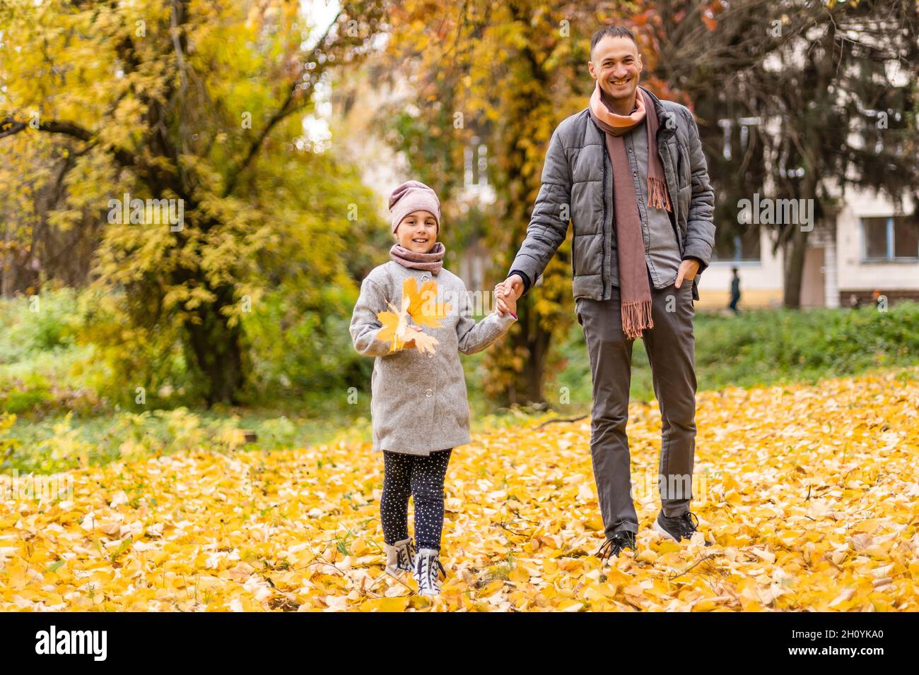 Happy father with daughter in fall season Stock Photo - Alamy