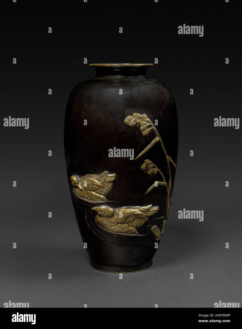 Bas relief Vase, c 1880. Japan, Meiji period (1868-1912). Bronze, gilding ; diameter of mouth: 6.4 cm (2 1/2 in.); overall: 27.9 x 15.2 cm (11 x 6 in.). Stock Photo