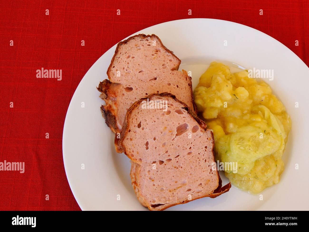 delicious traditional swabian leberkas with cold potato salad (a type of meat loaf popular in