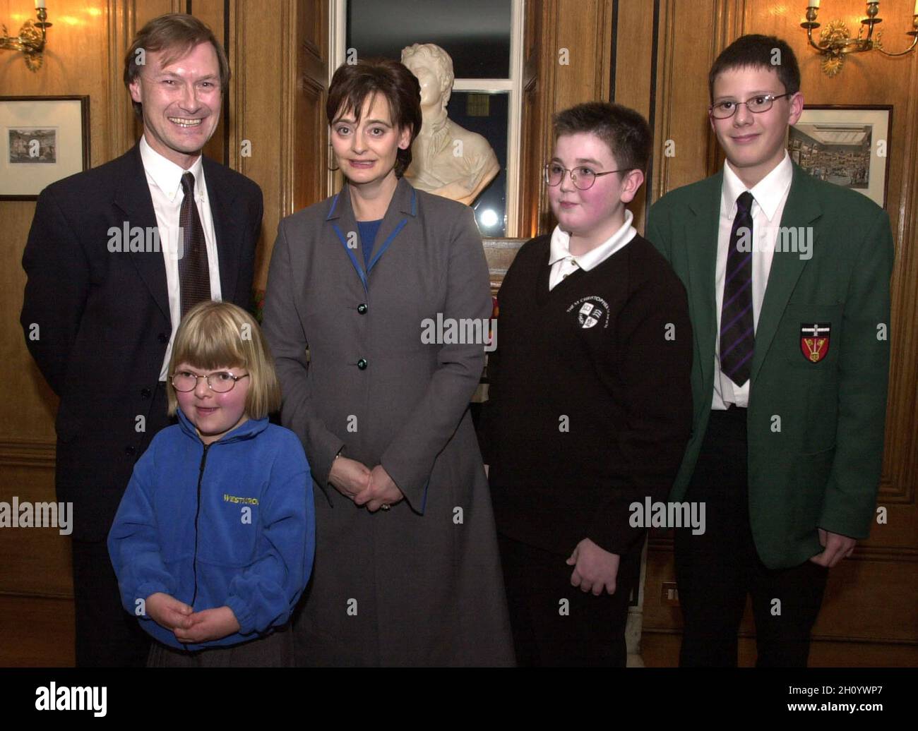 File photo dated 14/12/00 of the wife of the then Prime Minister, Cherie Blair hosting a tea party at No 10 Downing Street, London, with David Amess MP for Southend West, with his guests (from left: Louise Hebden, Jack Knight and Mark Bourne.Conservative MP Sir David Amess has reportedly been stabbed several times at a surgery in his Southend West constituency. Issue date: Friday October 15, 2021. Stock Photo