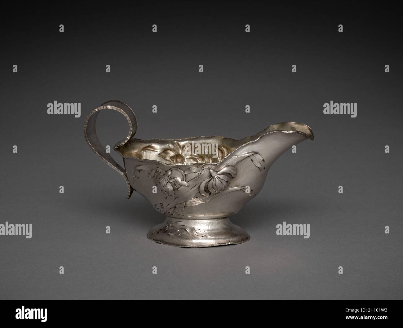 Sauce Boat and Tray, c. 1890. Barbour Silver Company (American), attributed to William Christmas Codman (British, 1839-1921). Silver; overall: 11.4 x 19.7 x 9.8 cm (4 1/2 x 7 3/4 x 3 7/8 in.). Stock Photo