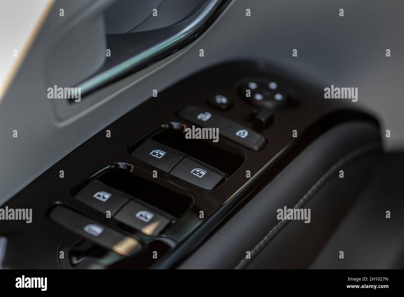 Close up view of button controlling window in modern car interior ...