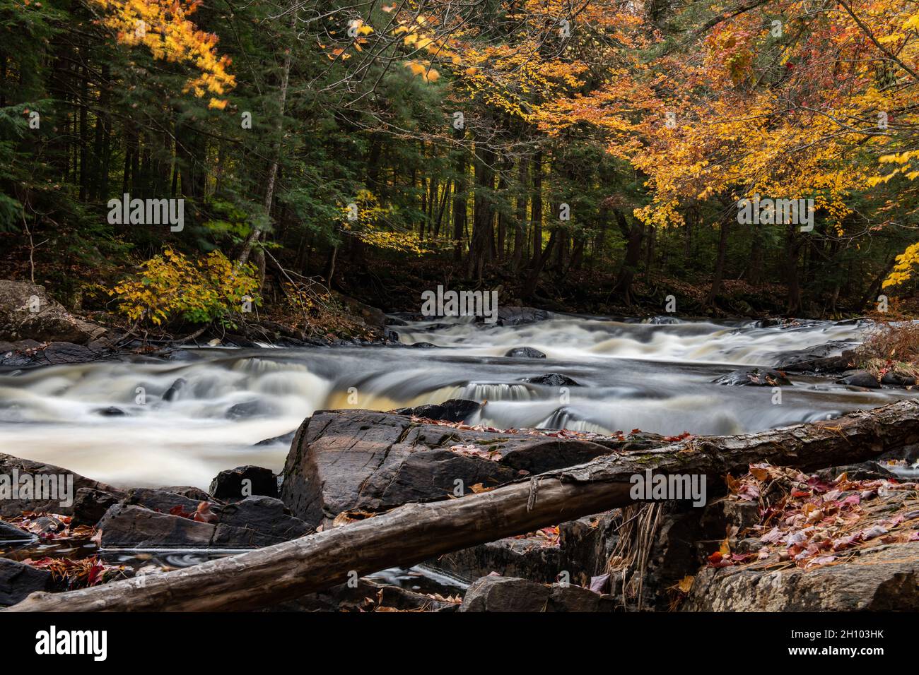 A long exposure image of falls on the Sacandaga River in the Adirondack Mountains, NY USA in autumn Stock Photo