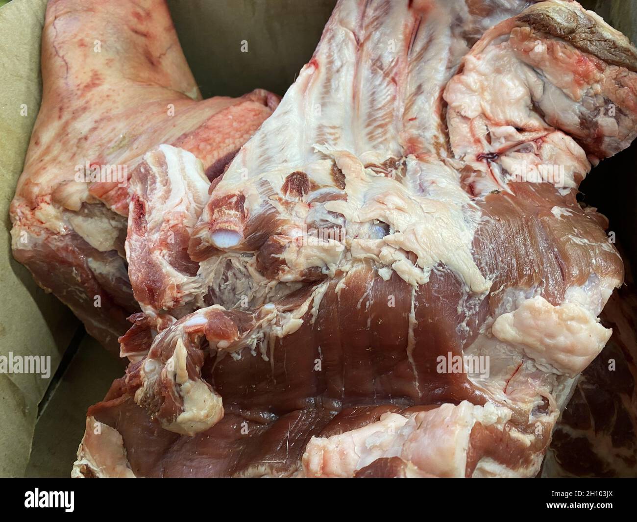 Sale of fresh meat. A large piece of meat on the counter of a store close-up. Different types of pork and beef Stock Photo