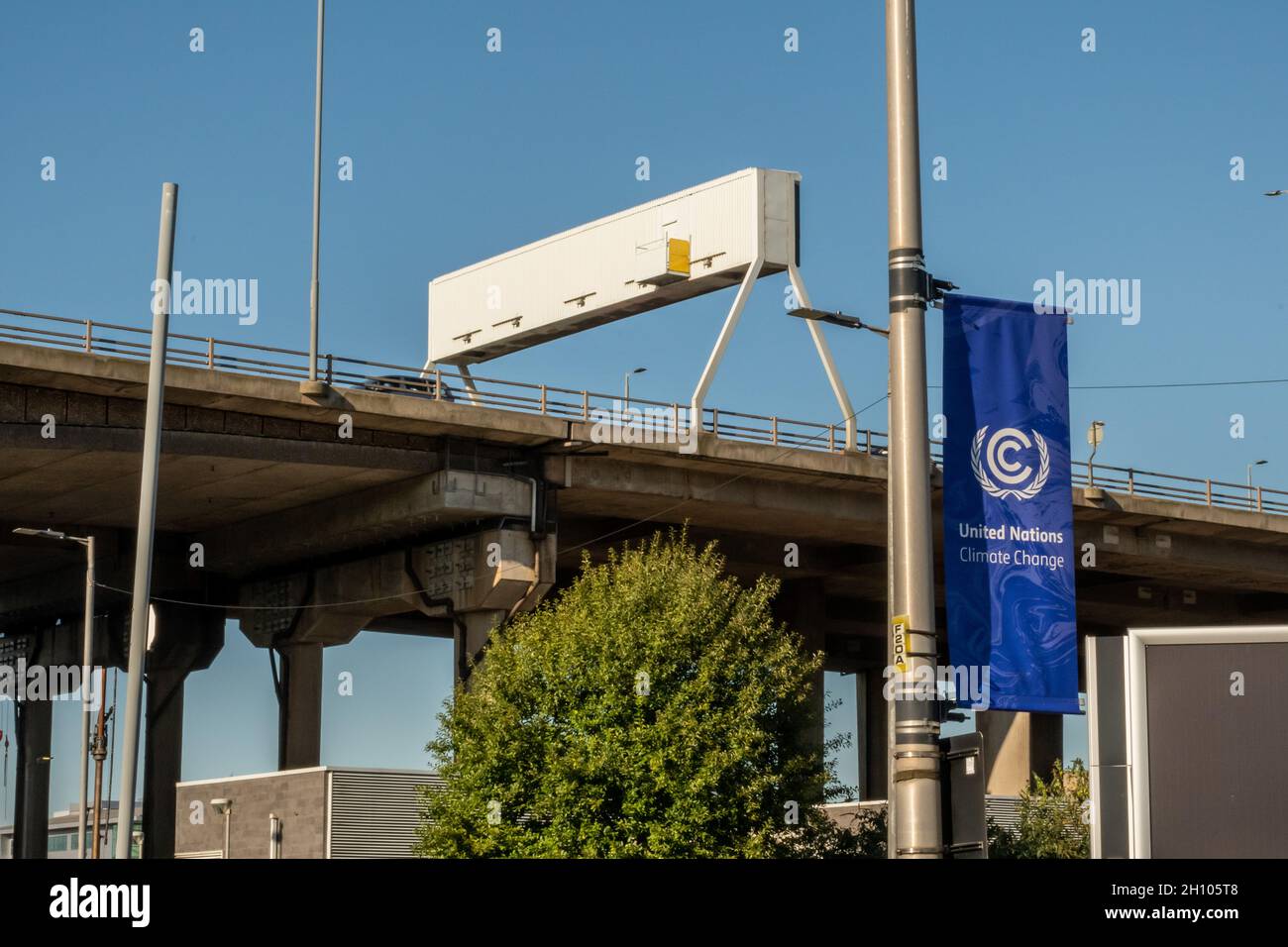 The motorway in Glasgow with a UN Climate Change poster in the foreground as the city prepares for disruption and road closures as host city of COP26. Stock Photo