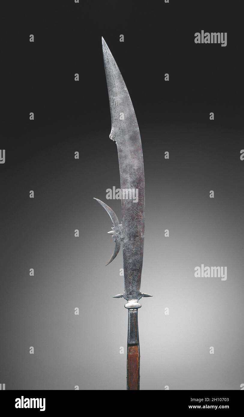 Glaive (with Arms of Giustini Family), c. 1600–1620. Italy, Venice, 17th  century. Steel, etched; wood haft; overall: 184.5 cm (72 5/8 in.); blade:  15.2 cm (6 in.). A glaive is a long