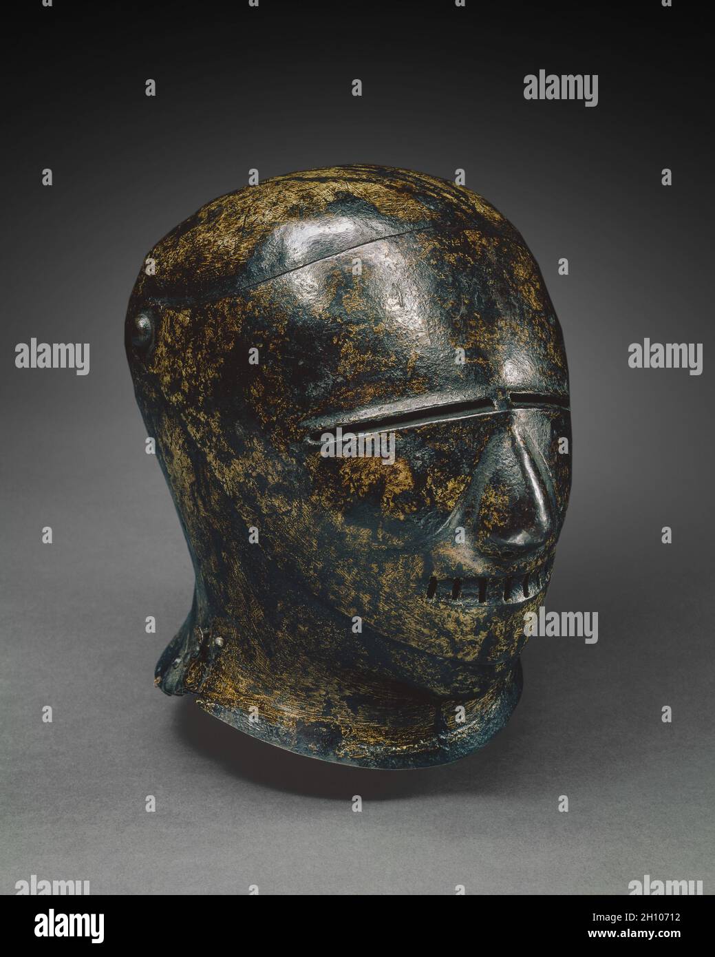 Closed Sallet with Grotesque Face (Schembart visor), c. 1500. Germany, Nuremberg, early 16th Century. Painted steel; overall: 27.3 x 25.7 x 22.2 cm (10 3/4 x 10 1/8 x 8 3/4 in.).  A small number of similar painted helmets survive today. All appear to date to the early 1500s. The visors of these helmets are usually in the form of fiercely grimacing human or animal faces, known as Schembart visors after the masked revelers in the Schembartlaufen, the medieval Shrovetide parades. The city of Nuremberg was particularly famous for its Shrovetide parades that were often held in conjunction with a to Stock Photo