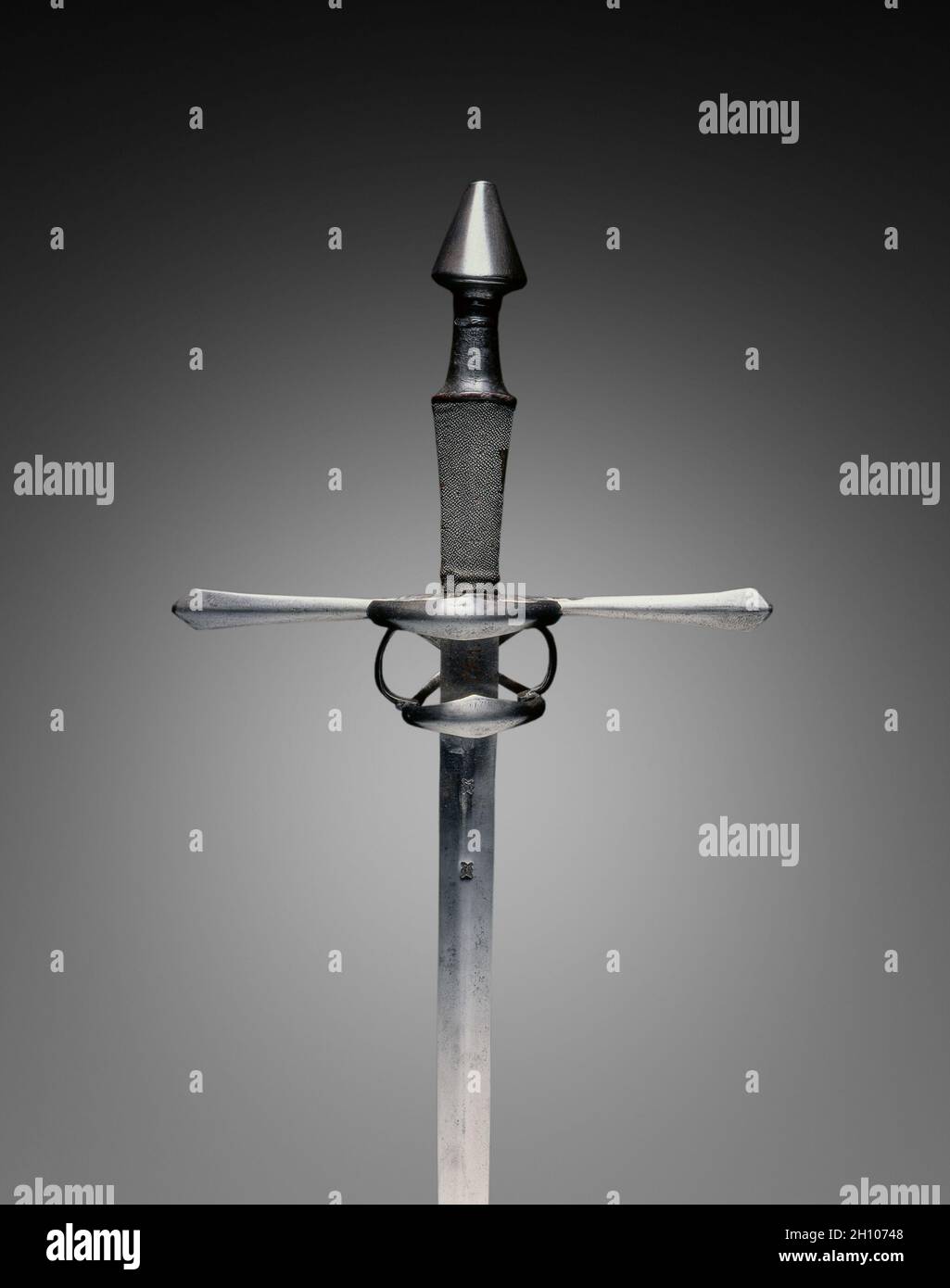 Hand-and-a-Half Sword, c.1540–80. Germany, 16th century. Steel; wood, leather, sharkskin grip; overall: 116.8 cm (46 in.); blade: 94.8 cm (37 5/16 in.); quillions: 31 cm (12 3/16 in.); grip: 21 cm (8 1/4 in.). Stock Photo