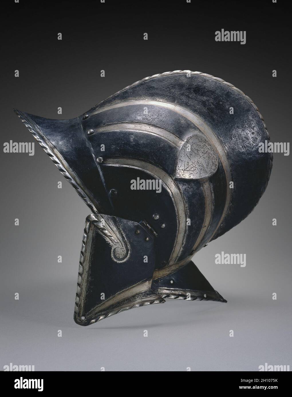Black and White Burgonet (of the Civic Guard of Bologna), c. 1580-1600. Italy, late 16th Century. Steel with black paint; overall: 31.8 x 35.6 x 19 cm (12 1/2 x 14 x 7 1/2 in.). Stock Photo