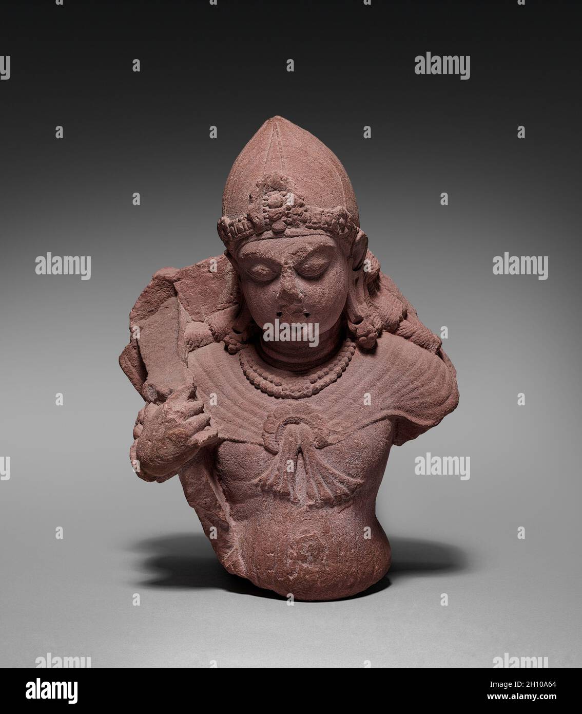 Attendant of Surya, the Sun God, AD 320–650. India, Mathura, Gupta Period (320-647). Sandstone; overall: 33.7 x 24.8 cm (13 1/4 x 9 3/4 in.). Stock Photo