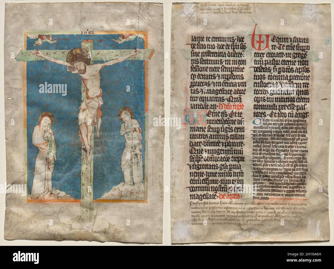 Leaf from a Missal: The Crucifixion (recto) and Text (verso), c. 1330-40. Bohemia. Ink, tempera, and gold leaf on parchment; sheet: 35.4 x 23.5 cm (13 15/16 x 9 1/4 in.).  The crucified Christ was a central theme of medieval visual art. Each period set its own artistic and iconographic priorities, depending on the function and context of the works. For example, the dead Christ with his head bowed, the side wound dripping with blood, and the richly designed loincloth is characteristic of the 1300s. This miniature is from Bohemia (present-day Czech Republic and Slovakia), with its capital, Pragu Stock Photo