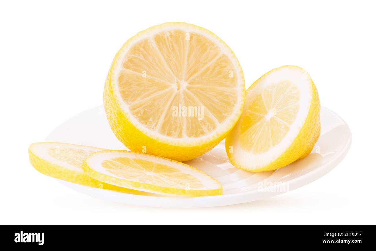 Sliced ​​lemon on a white platter isolated on white background. Clipping Path. Full depth of field. Stock Photo