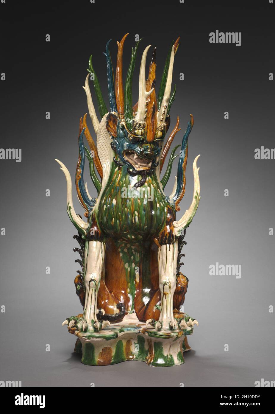 Tomb Guardian with Animal Head, early 700s. China, probably Shaanxi province, Xi'an, Tang dynasty (618-907). Glazed earthenware, sancai (three-color) ware; overall: 92.3 x 43.8 x 41.9 cm (36 5/16 x 17 1/4 x 16 1/2 in.). Stock Photo
