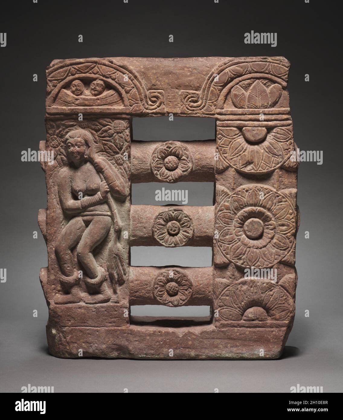 Section of Monolithic Railing with Bather and Lotus Medallions, c. AD 150–250. India, Mathura, Kushan period (c. 80-375). Red sandstone; overall: 53.3 x 45.8 cm (21 x 18 1/16 in.). Stock Photo