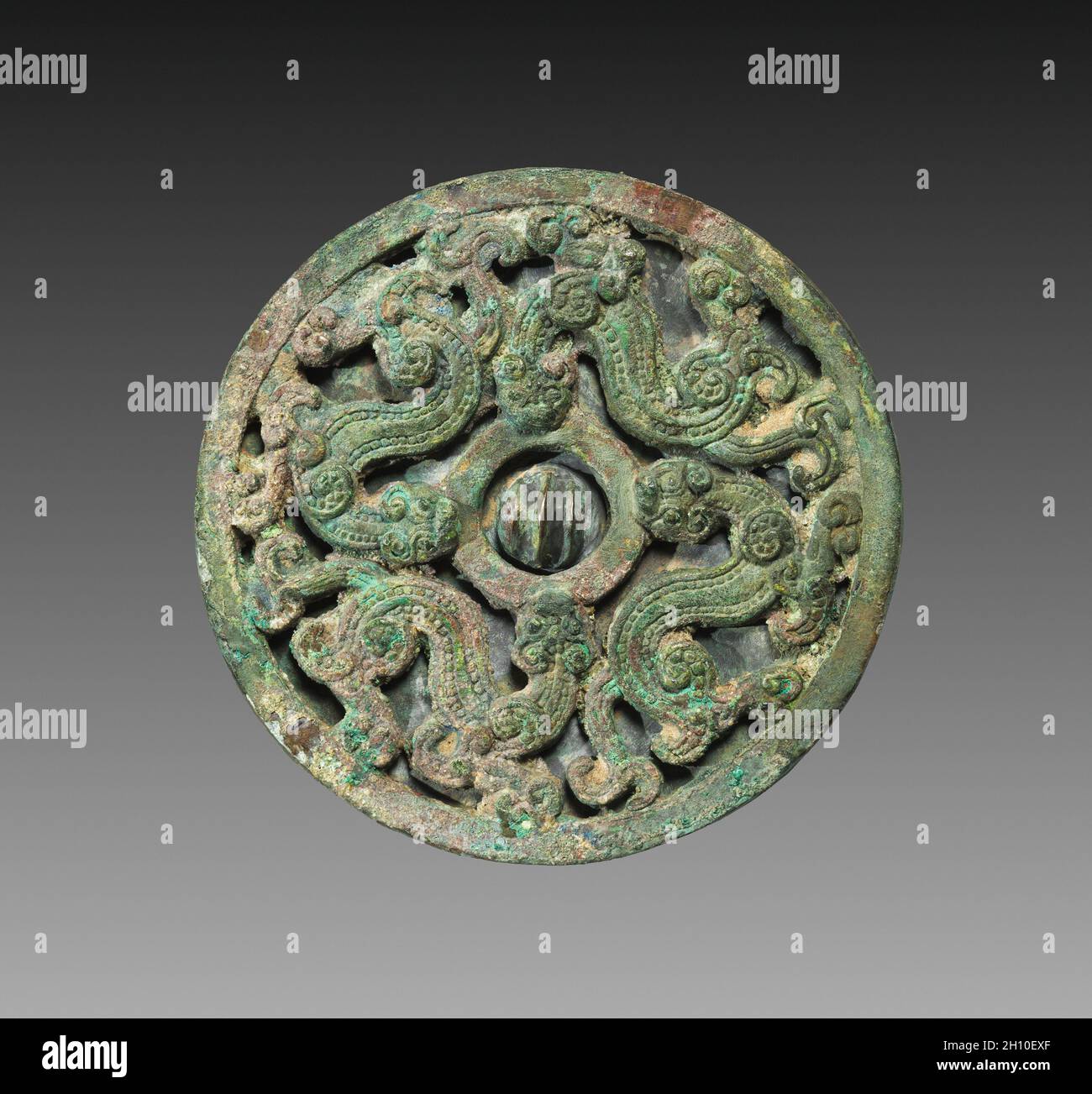 Double-tier Mirror, 300s BC. China, Warring States period (475-221 BC). Bronze; diameter: 7.6 cm (3 in.); overall: 0.8 cm (5/16 in.); rim: 0.5 cm (3/16 in.). Stock Photo
