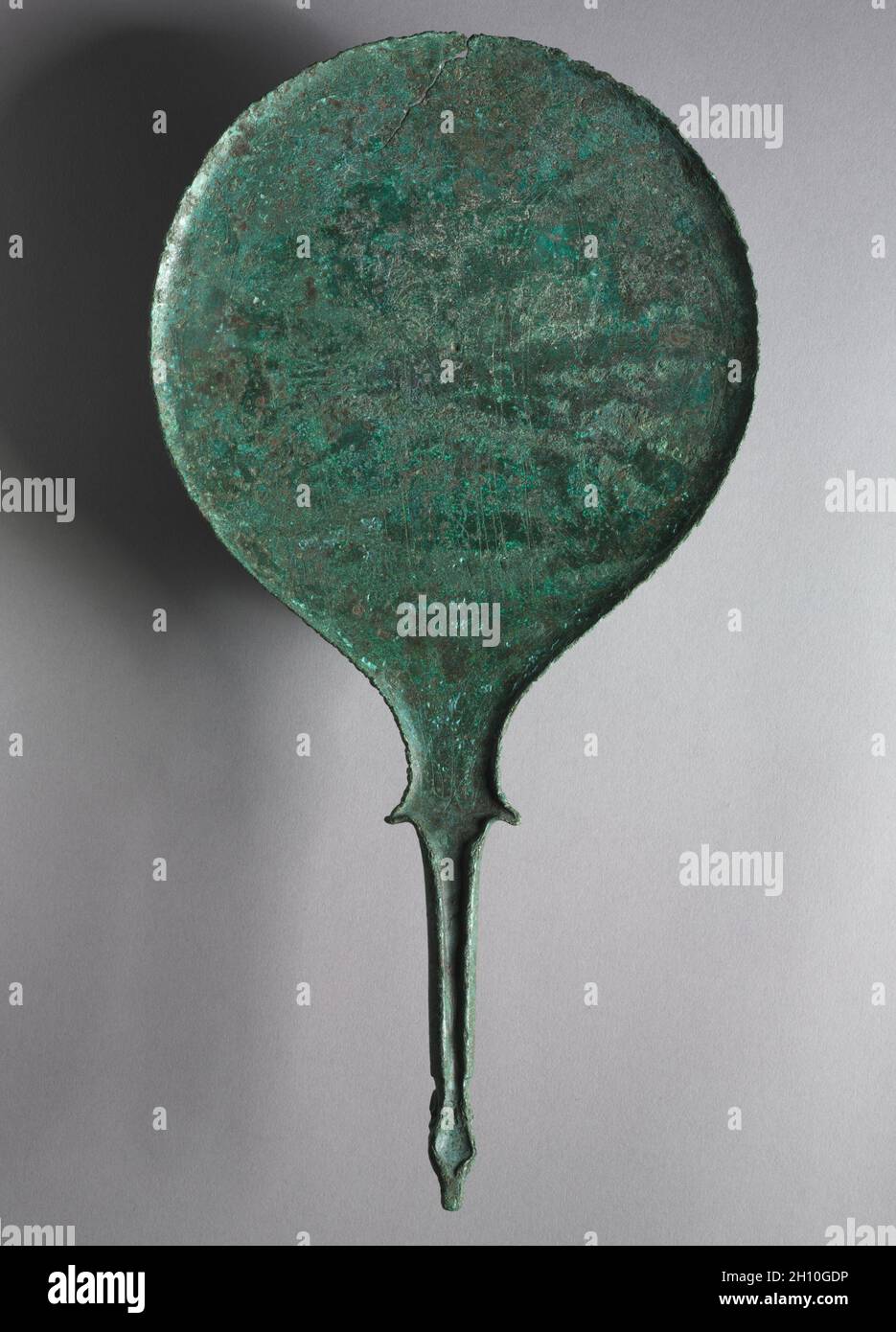 Mirror with Engraved Scene: Two Female Figures, 330-300 BC. Italy, Etruscan, 4th century BC. Bronze; overall: 36 cm (14 3/16 in.). Stock Photo
