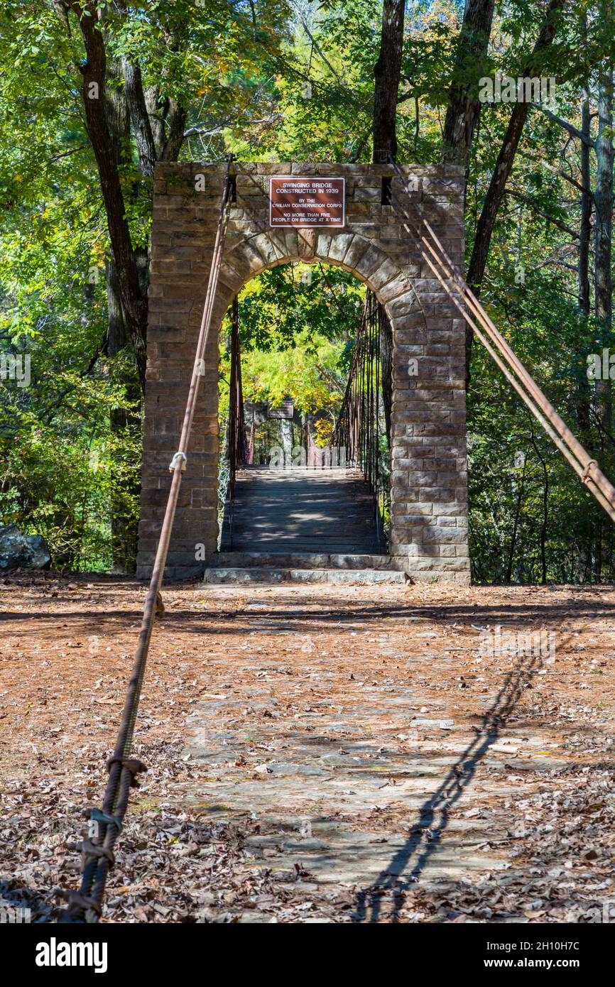 Swinging bridge constructed in 1939 at Tishomingo State Park in northeast Mississippi Stock Photo