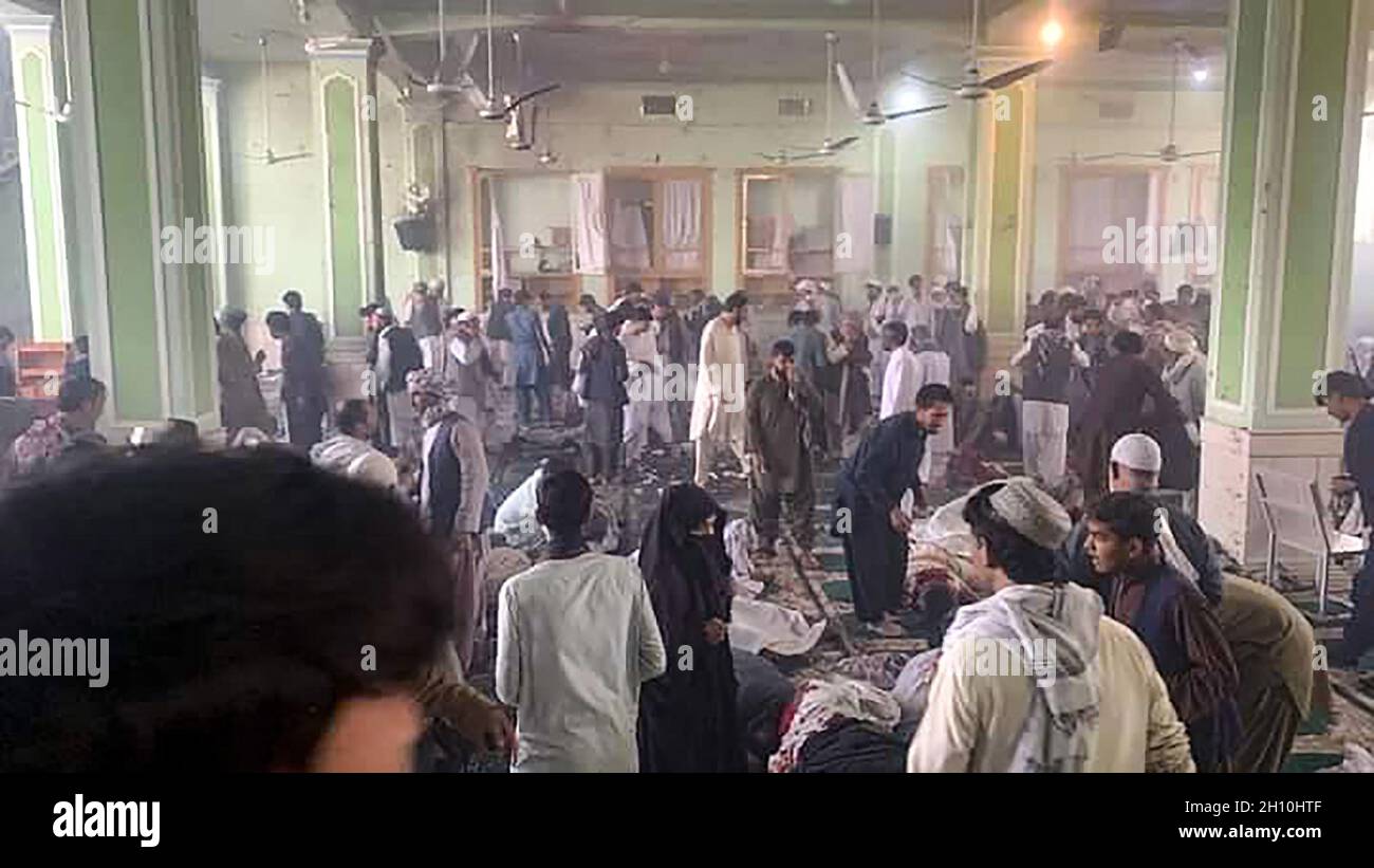 Kandahar, Afghanistan. 15th Oct, 2021. Afghan men inspect the damage and victims inside a Shiite mosque after a suicide bomb blasts during Friday congregational prayers at Shi'ite Muslims Mosque in Kandahar, Afghanistan, on Friday, October 15, 2021. At least 40 people were killed and dozens others injured in the blast during the Friday noon prayer that is usually attended by about 500, witnesses said. Photo by Razmal/ Credit: UPI/Alamy Live News Stock Photo