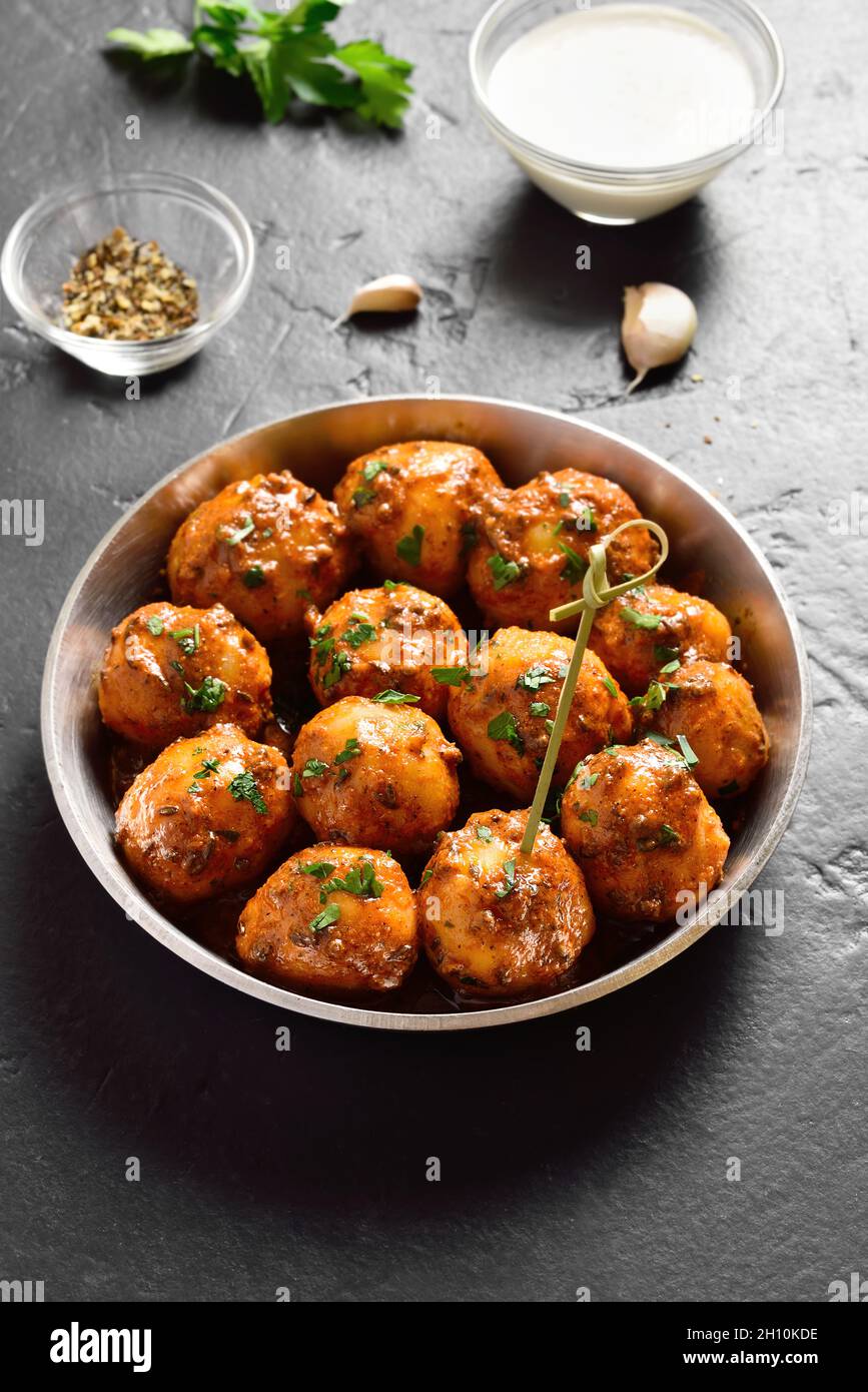 Pan fried little baby potatoes with jeera seeds and coriander in bowl