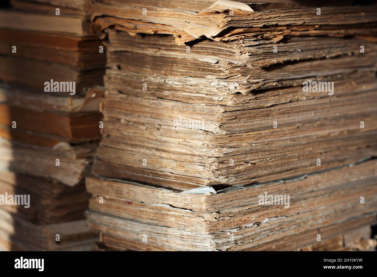 A lot of ragged antique books in soft cover Stock Photo