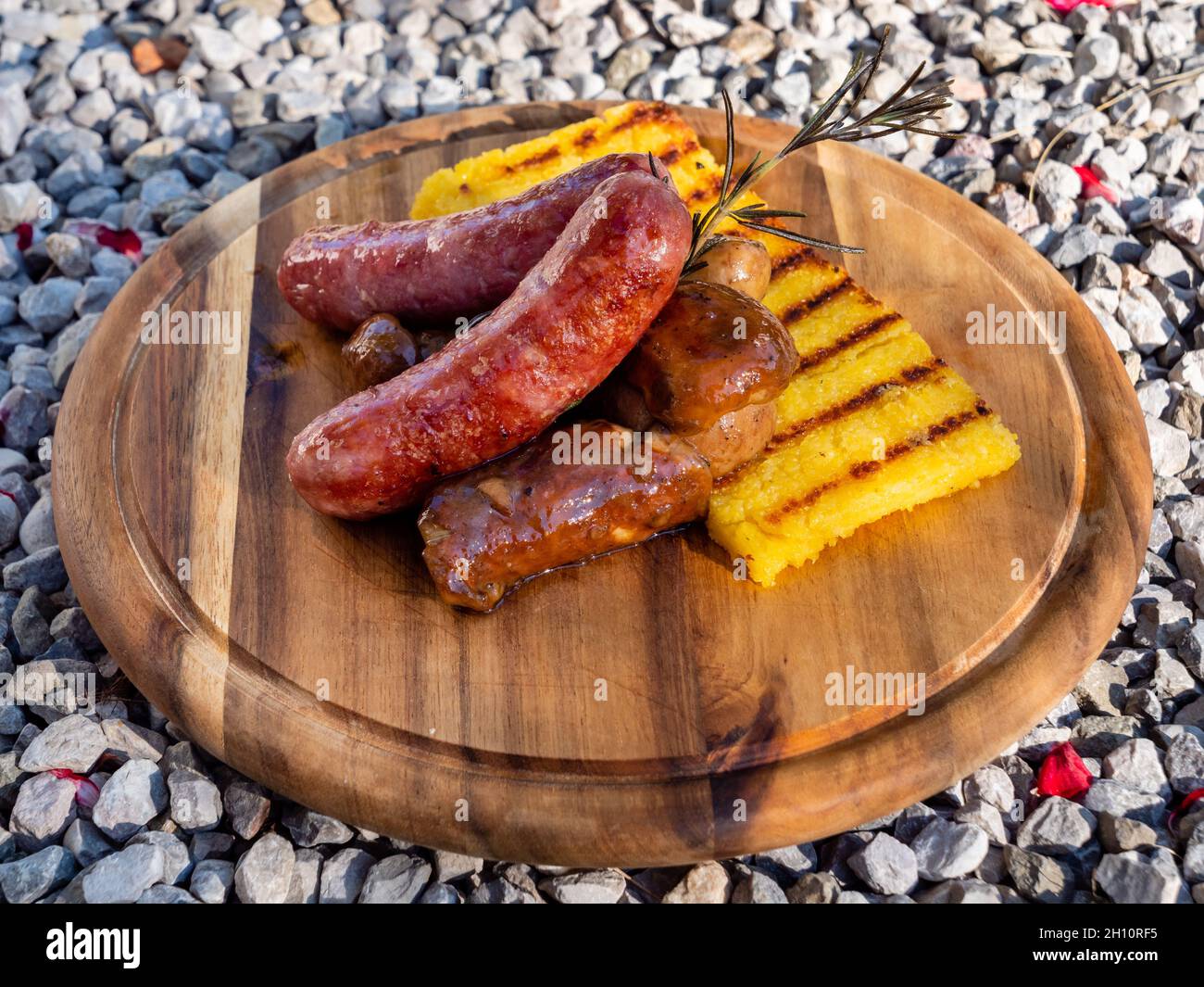 Salsiccia Italian Sausage with Sauteed Funghi Porcini or Cep Mushrooms and Grilled Polenta Side View Stock Photo