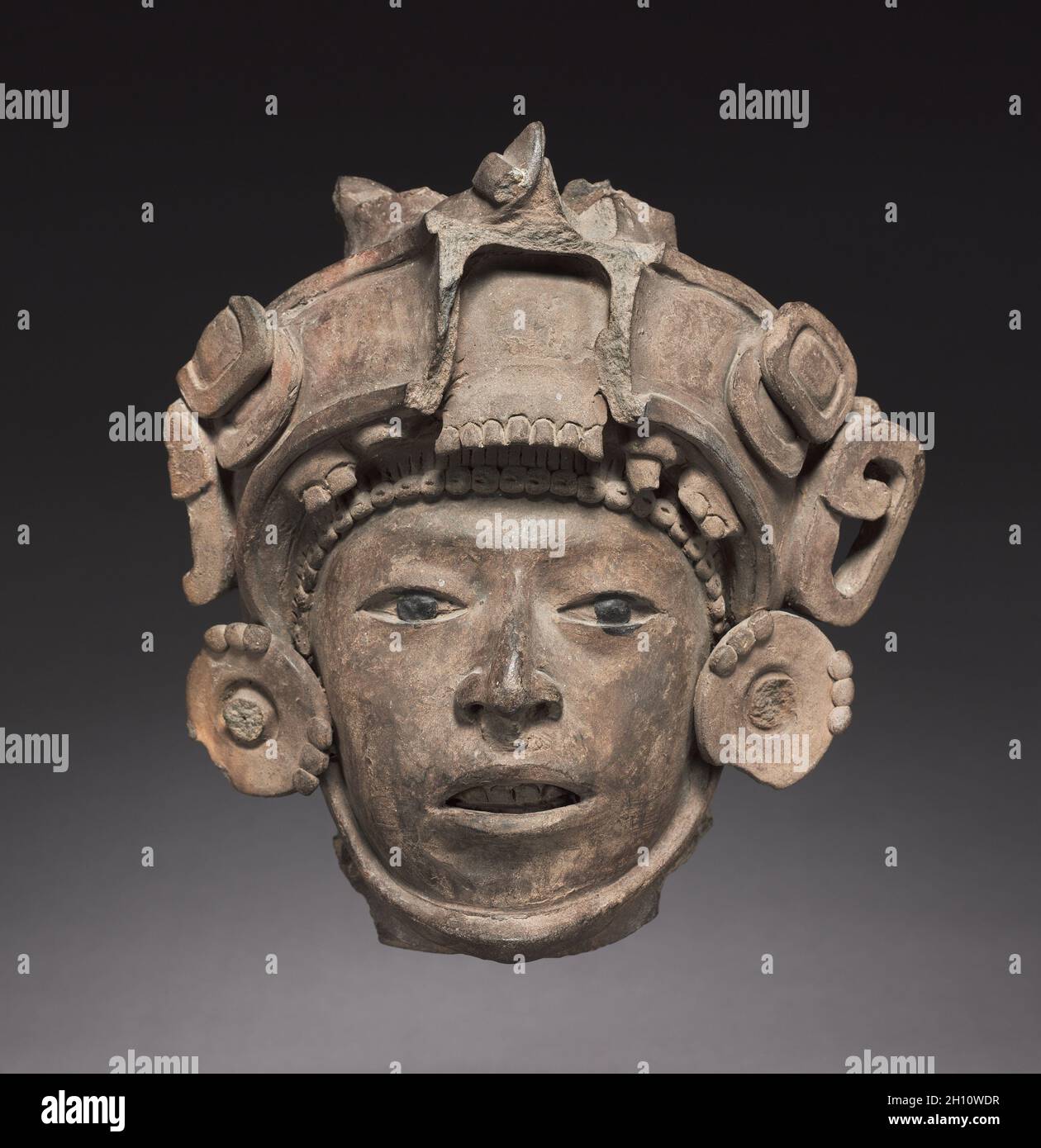 Head, c. 600-900. Mexico, Classic Veracruz, 7th-10th Century. Earthenware; overall: 17 x 13.5 x 8.9 cm (6 11/16 x 5 5/16 x 3 1/2 in.). Stock Photo