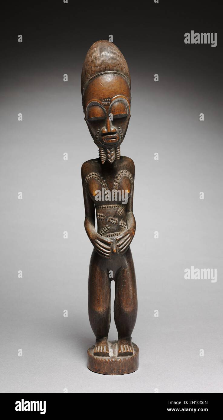 Male Figure, by 1931. Execution Totokro Master. Wood; overall: 44.8 x 9.3 x 7.7 cm (17 5/8 x 3 11/16 x 3 1/16 in.). Stock Photo