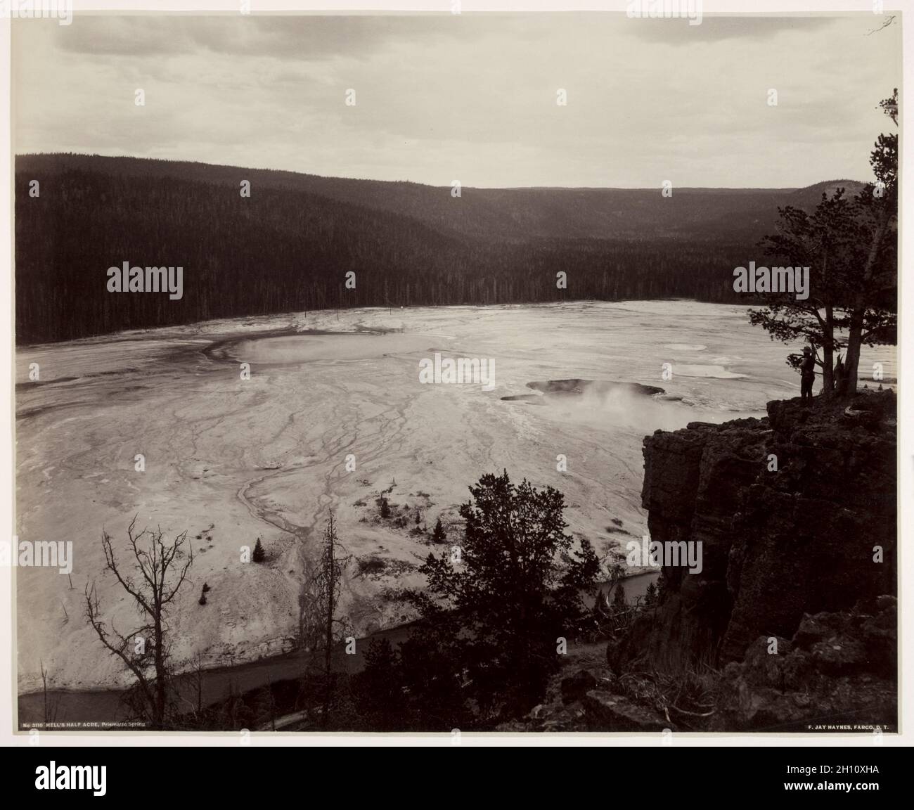 Hell's Half Acre, Prismatic Springs, c. late 1880s. Frank Jay Haynes (American, 1853-1921). Albumen print from glass negative; image: 44.7 x 54.5 cm (17 5/8 x 21 7/16 in.); paper: 45 x 55.1 cm (17 11/16 x 21 11/16 in.); matted: 61 x 76.2 cm (24 x 30 in.). Stock Photo