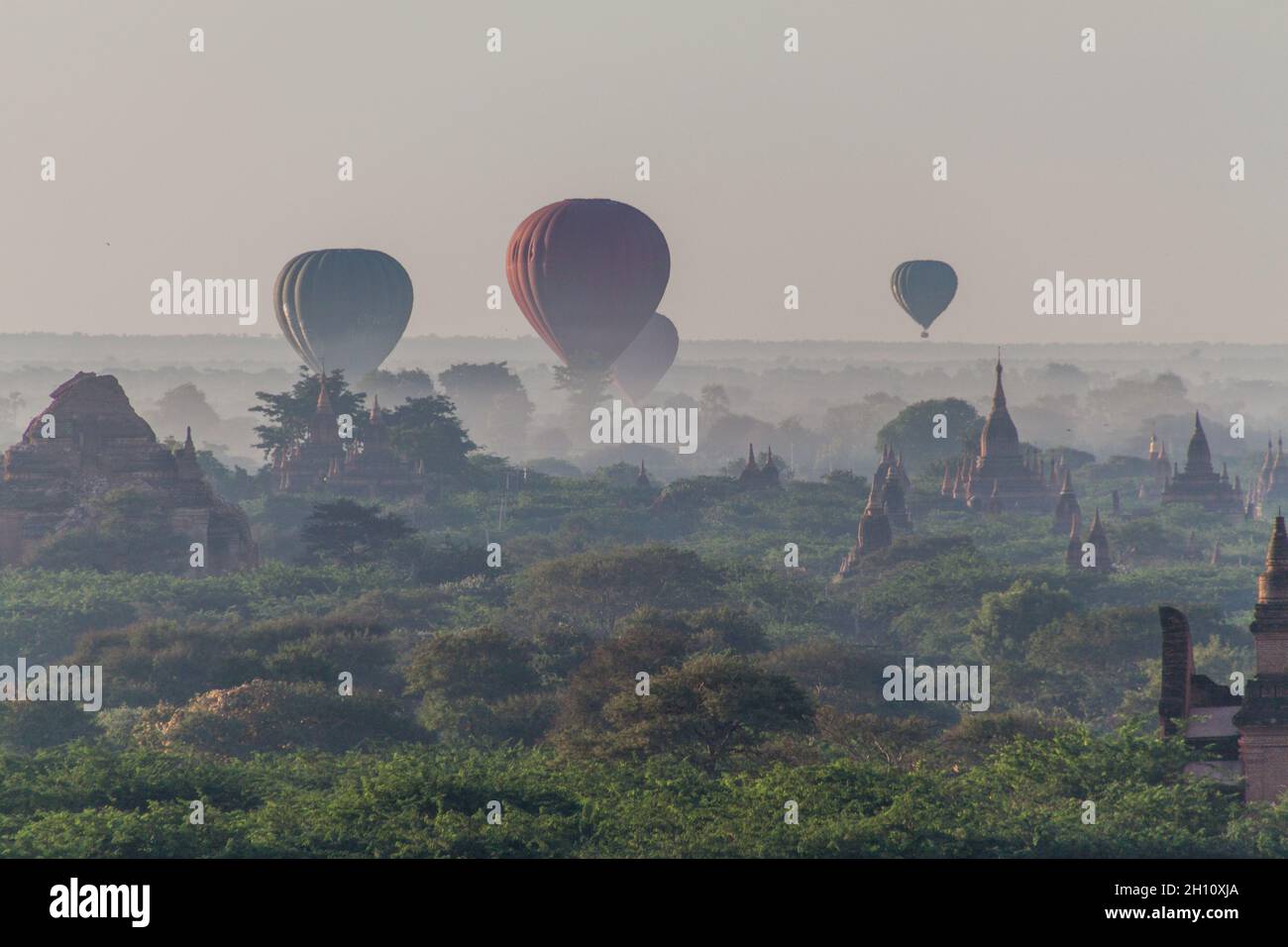 Balloon over Bagan - hot air balloons floating among the skyline of temples, Myanmar Stock Photo