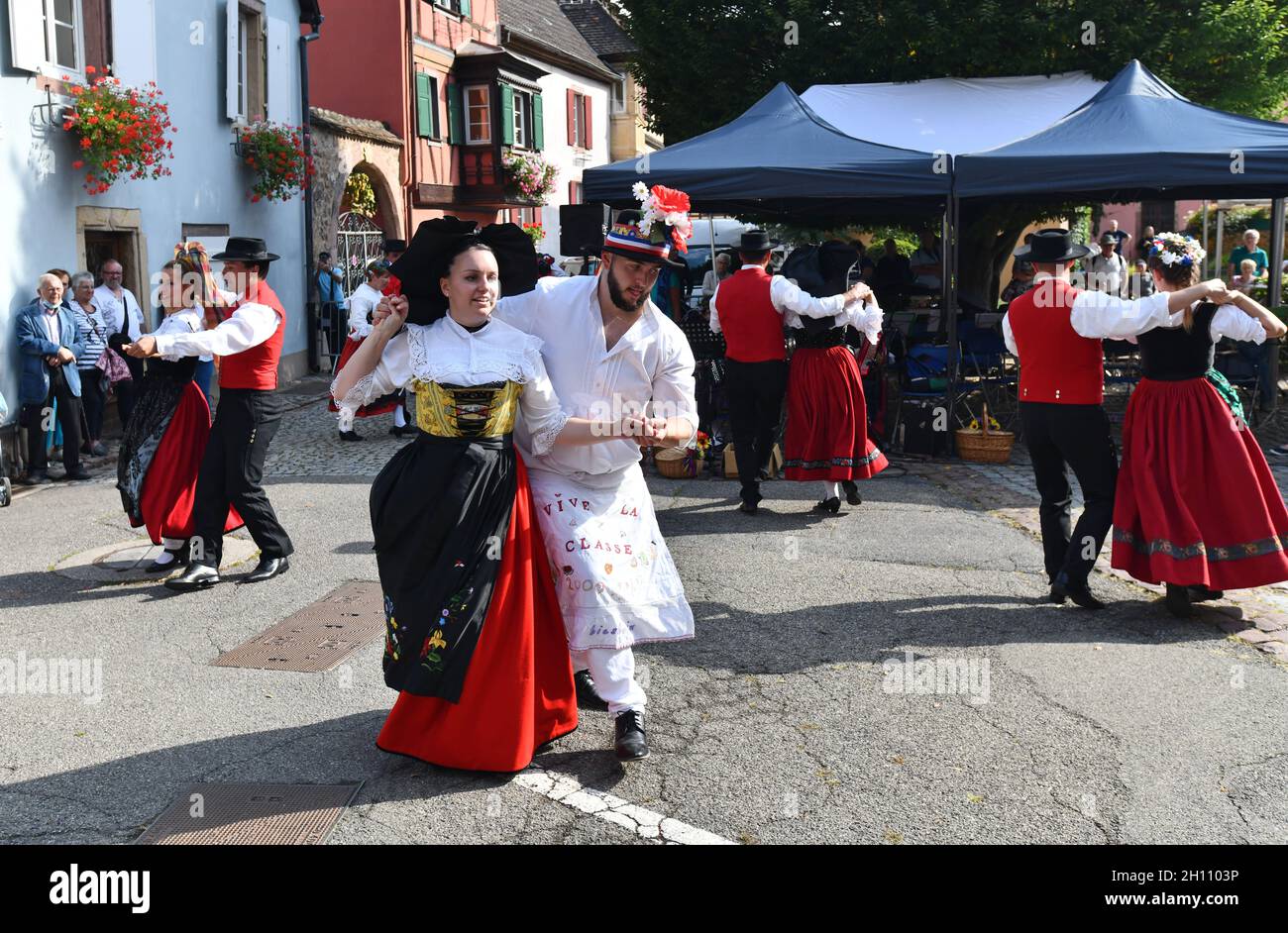 Traditional Alsace folk dancing in the village of Turkheim during the Alsace grape harvest 2021 Stock Photo