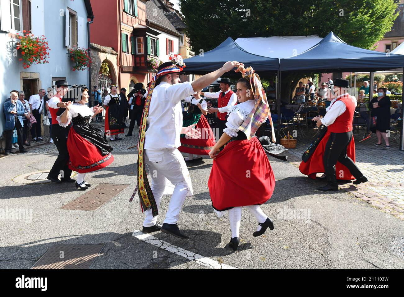 Traditional Alsace folk dancing in the village of Turkheim during the Alsace grape harvest 2021 Stock Photo