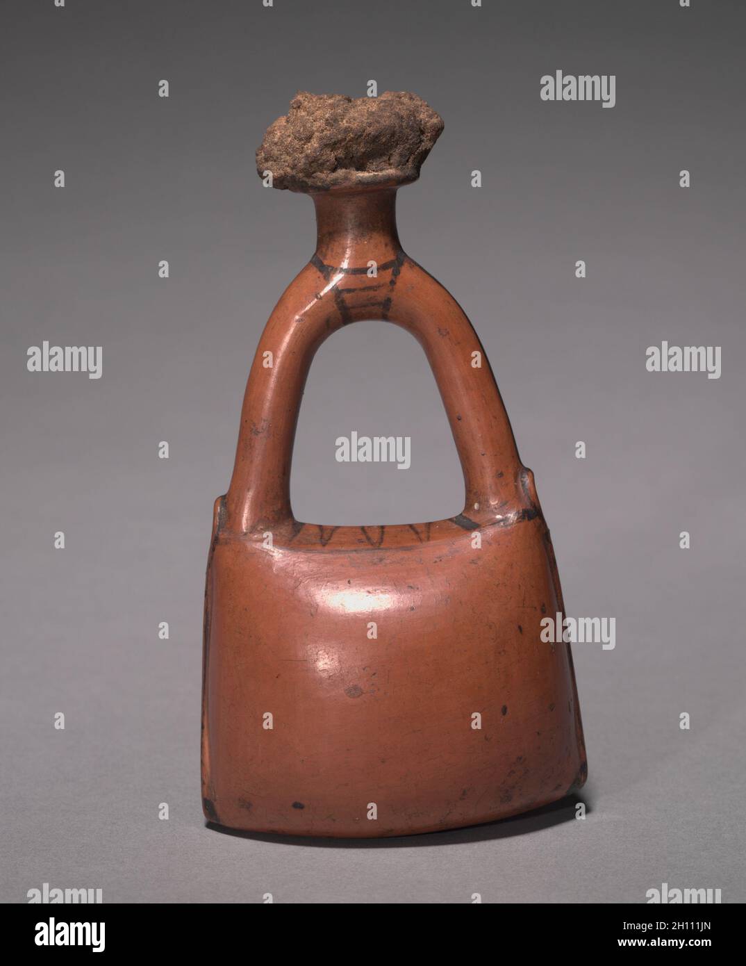 Flask in the Form of a Leather Bag, c. 1415-1381 BC. Egypt, New Kingdom, mid-Dynasty 18, late in the reign of Tuthmosis III to the early reign of Amenhotep III, 1479-1353 BC. Nile silt ware; overall: 13.5 x 7.4 x 5 cm (5 5/16 x 2 15/16 x 1 15/16 in.). Stock Photo