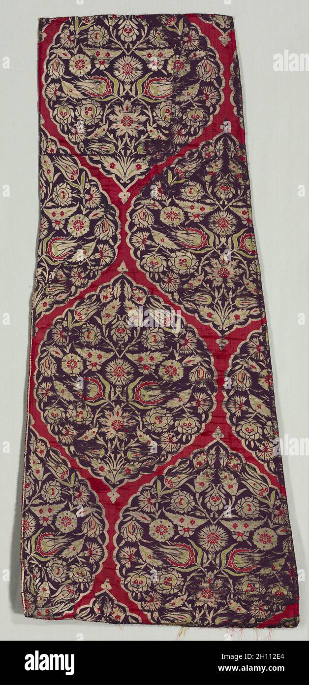 Brocaded silk with foliate medallions from a kaftan, 1525-75. Turkey, Istanbul, Ottoman period. Silk: lampas weave, silver-metal thread; overall: 105.7 x 49.5 cm (41 5/8 x 19 1/2 in.); mounted: 110.5 x 54.6 cm (43 1/2 x 21 1/2 in.). Stock Photo