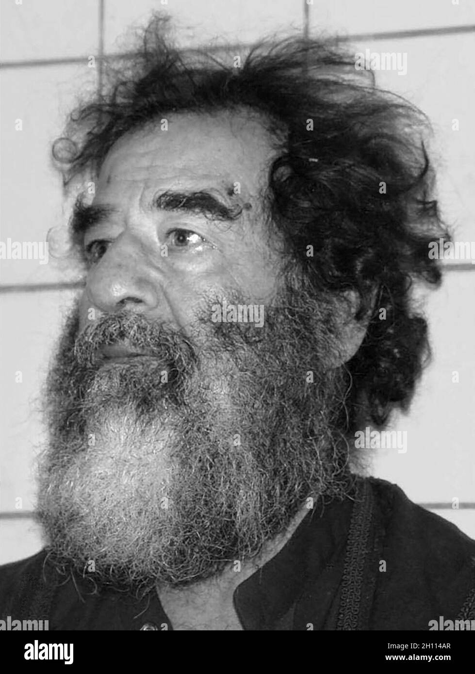 Saddam Hussain after his capture in ad-Dawr, Iraq, near Tikrit, by U.S. troops during Operation Red Dawn on December 13, 2003. Stock Photo