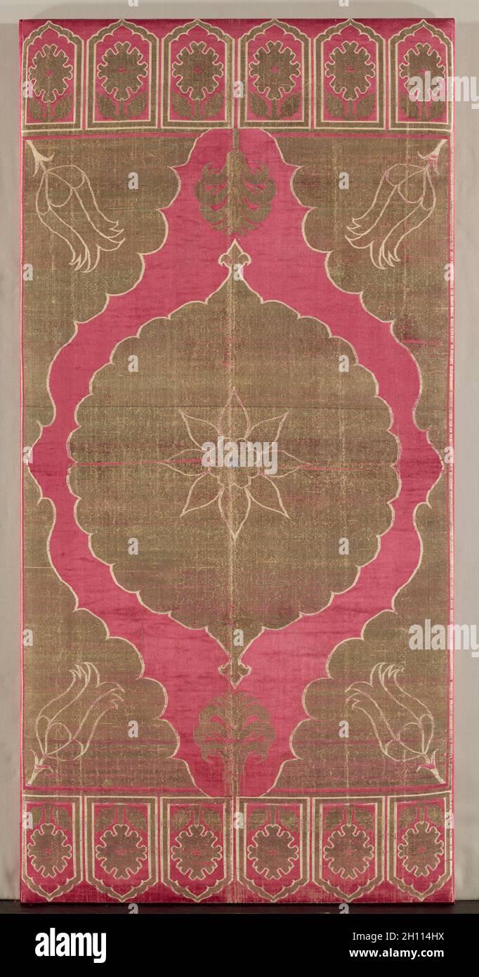 Lampas silk cushion cover, early 1600s. Turkey, Istanbul or Bursa. Lampas: silk and gilt-metal thread; overall: 136.8 x 66.6 cm (53 7/8 x 26 1/4 in.); mounted: 151.8 x 76.8 cm (59 3/4 x 30 1/4 in.). Stock Photo