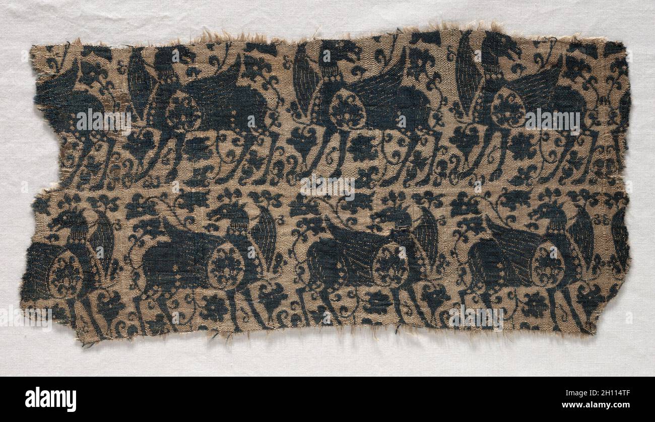 Fragment from Funeral Garment or Pall, before 1966. Iran ?, Seljuq period (1037–1194). Silk: compound tabby; overall: 27.6 x 13.6 cm (10 7/8 x 5 3/8 in.). Stock Photo