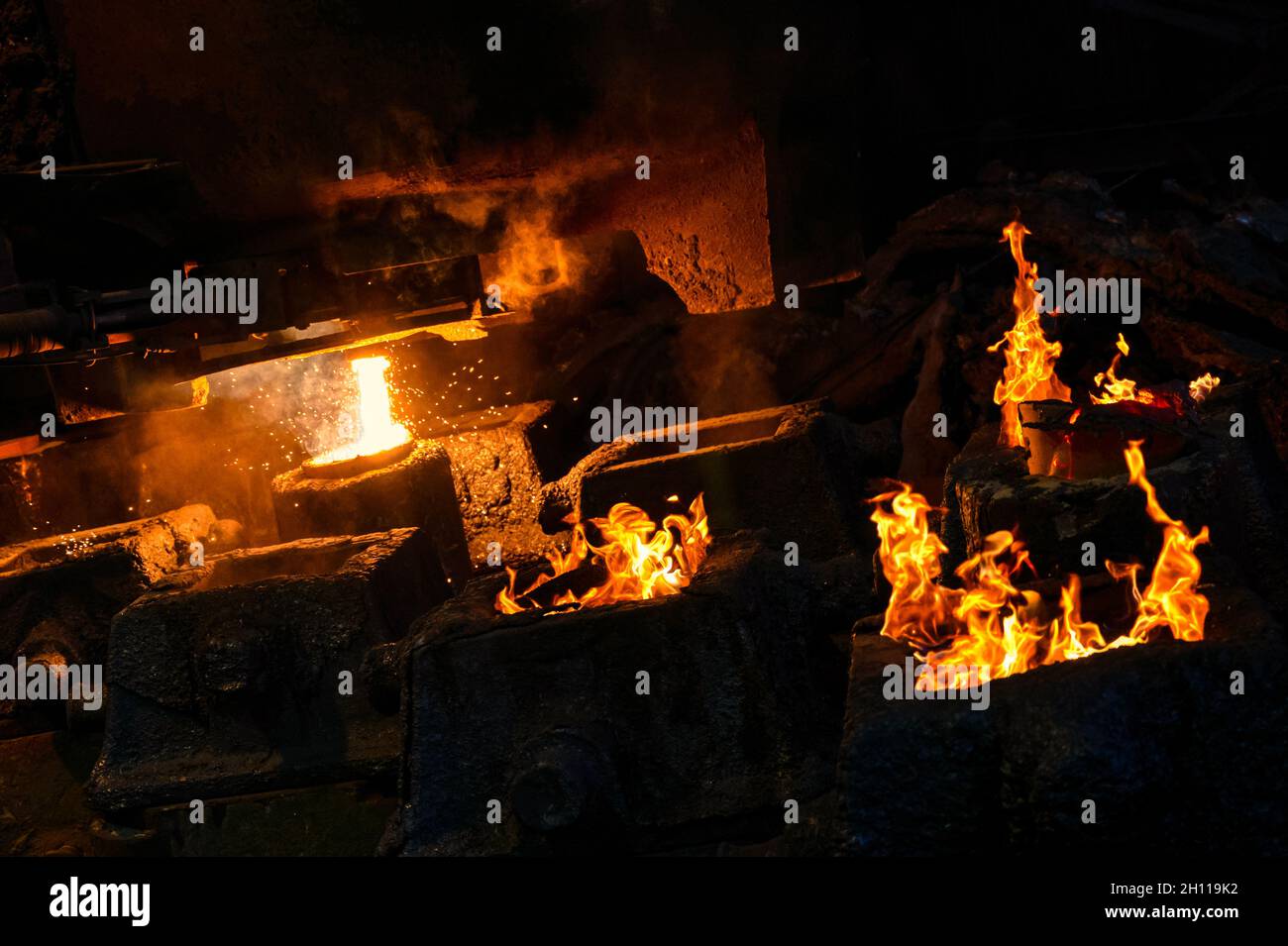 Liquid metal is poured into steel molds from metallurgical ladle Stock ...