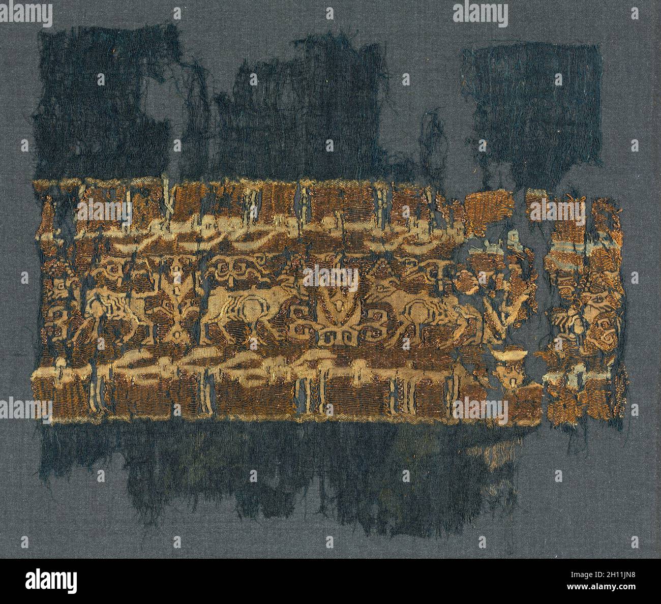 Tiraz with gold, 1020 - 1035. Egypt, Fatimid period, reign of Caliph al-Zahir, 1020–1035. Plain weave with inwoven tapestry weave: linen, silk, and gold filé; overall: 16.9 x 9.7 cm (6 5/8 x 3 13/16 in.). Stock Photo