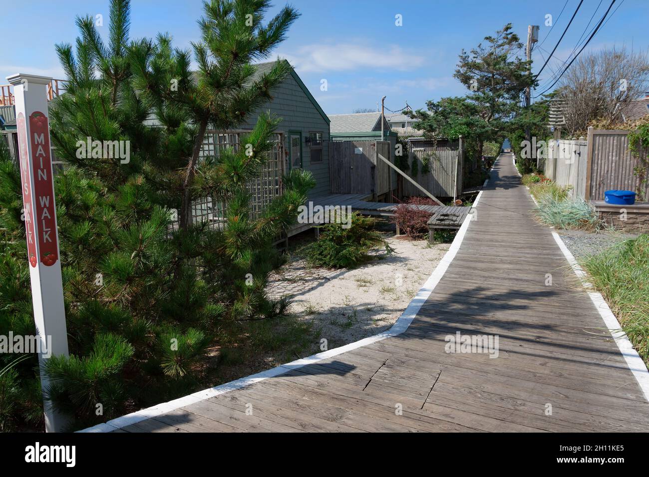 Main Walk boardwalk in Cherry Grove, Fire Island, New York, Suffolk County, USA. Stock Photo