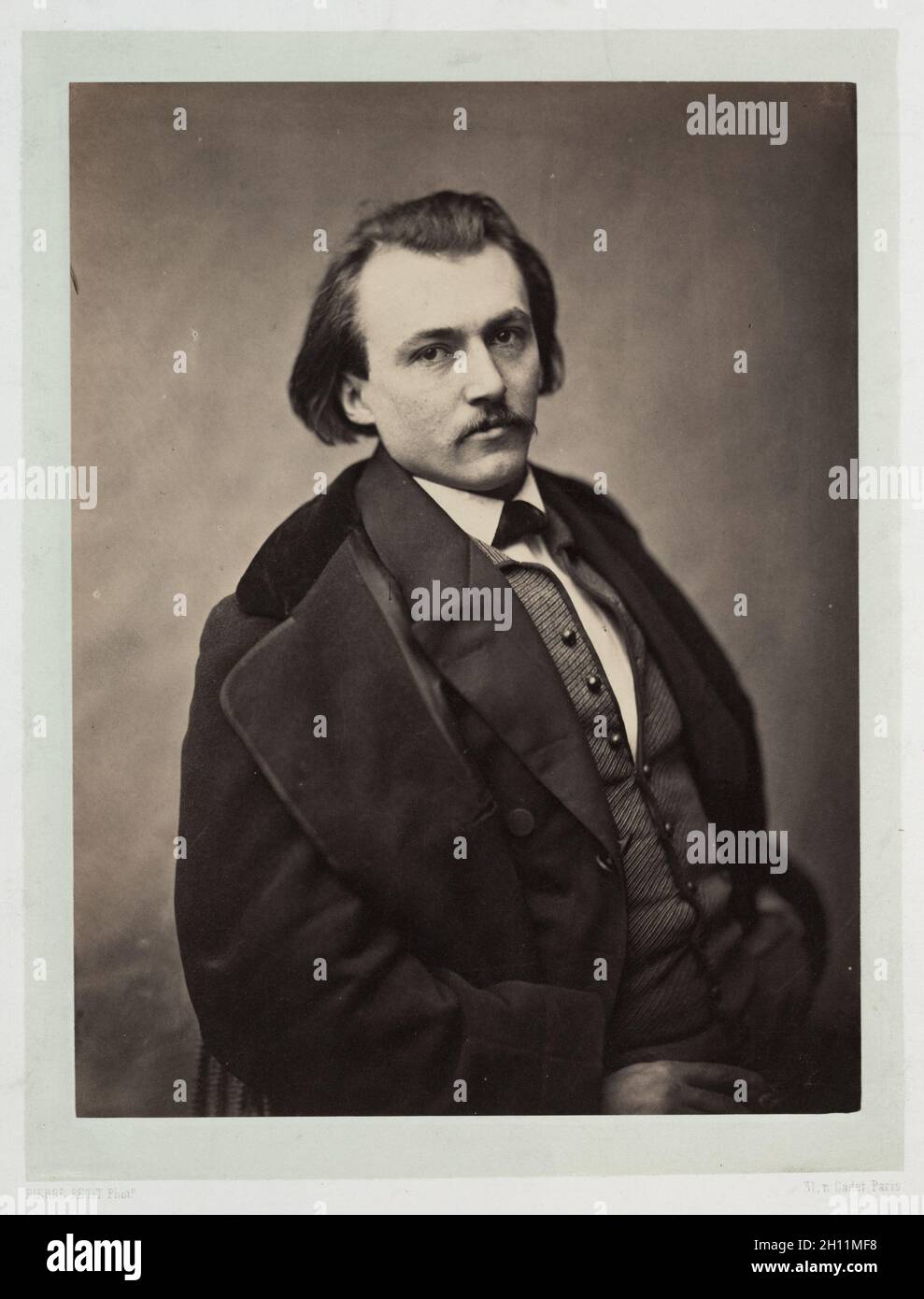 Gustave Doré, 1860. Pierre Petit (French, 1832-1909). Albumen print from wet collodion negative; image: 25 x 19 cm (9 13/16 x 7 1/2 in.); paper: 48.1 x 31 cm (18 15/16 x 12 3/16 in.); matted: 55.9 x 45.7 cm (22 x 18 in.). Stock Photo
