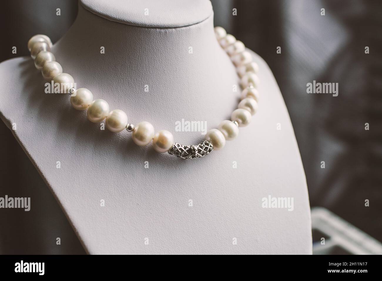 jewellery display bust with white pearl necklace Stock Photo Alamy