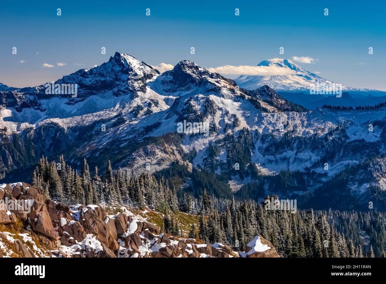 Looking across the Tatoosh Range to Mount Adams as October snow comes to the Paradise area of Mount Rainier National Park, Washington State, USA Stock Photo