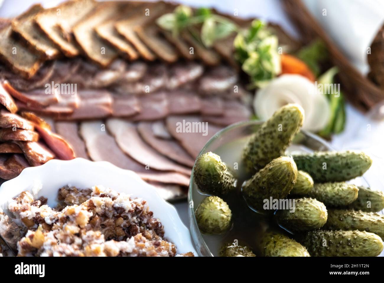 Meats on the table, lard and pickled cucumbers. Polish food, cold
