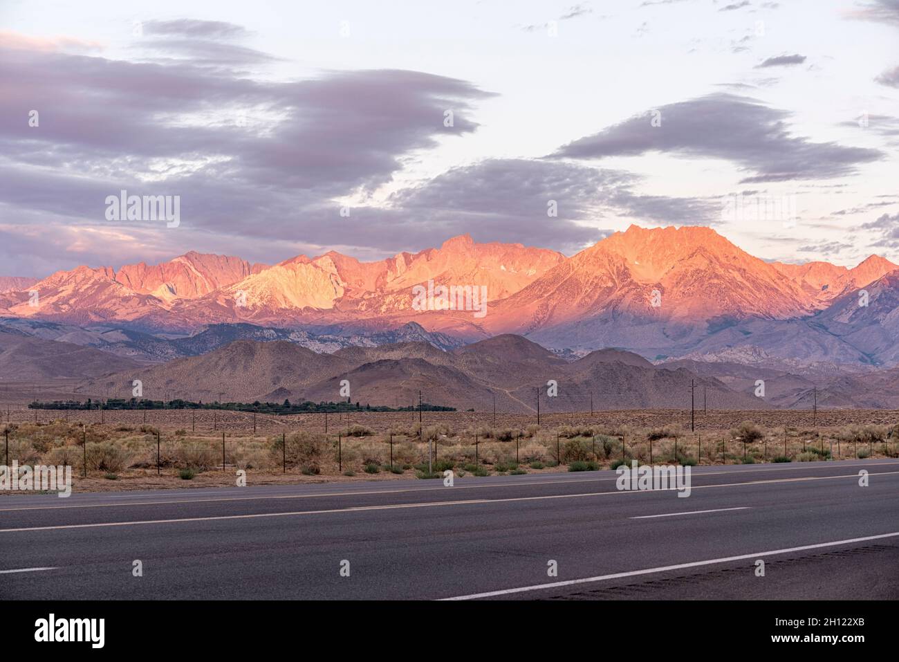 Beautiful morning light illuminates the mountain landscape. View from along US Route 395 in Bishop, CA, USA. Stock Photo