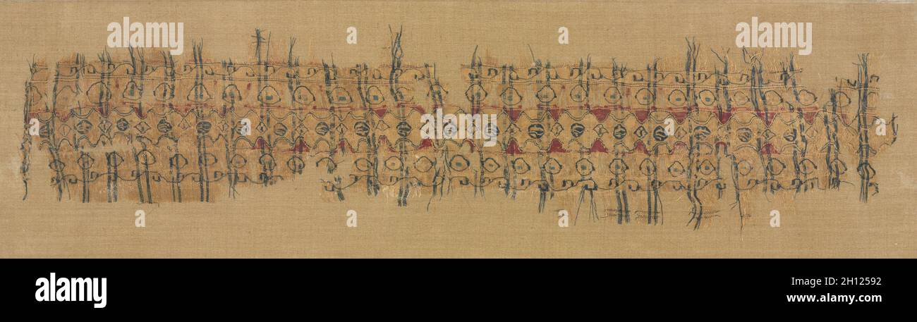 Plaid tiraz, 1101-1149. Egypt, Fatimid period, reign of Caliph al-Amir or al-Hafiz. Plain weave with inwoven tapestry weave: linen and silk; overall: 12.5 x 51.8 cm (4 15/16 x 20 3/8 in.). Stock Photo