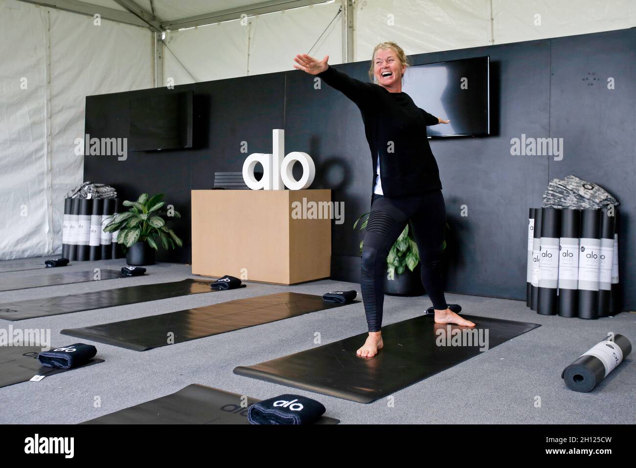 Fair Hill, MD, USA. 15th Oct, 2021. October 15, 2021: Jonelle Price holds a pose while being shown around the Alo Yoga booth during the Maryland Five-Star at the Fair Hill Special Event Zone in Fair Hill, Maryland on October 15, 2021. Jon Durr/Eclipse Sportswire/CSM/Alamy Live News Stock Photo