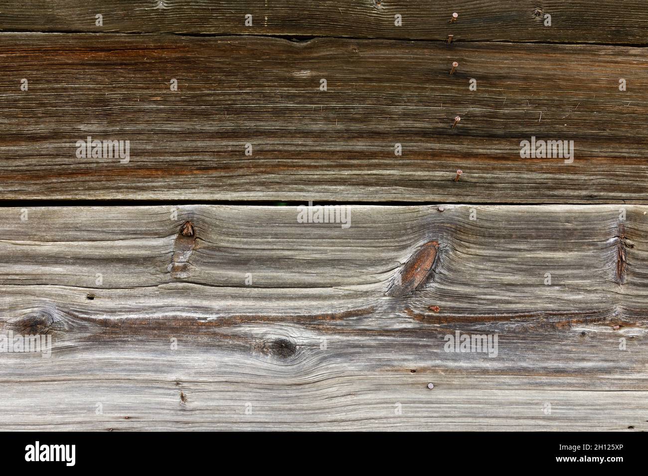 Texture and patterns in rustic weathered wood background with knots. Stock Photo