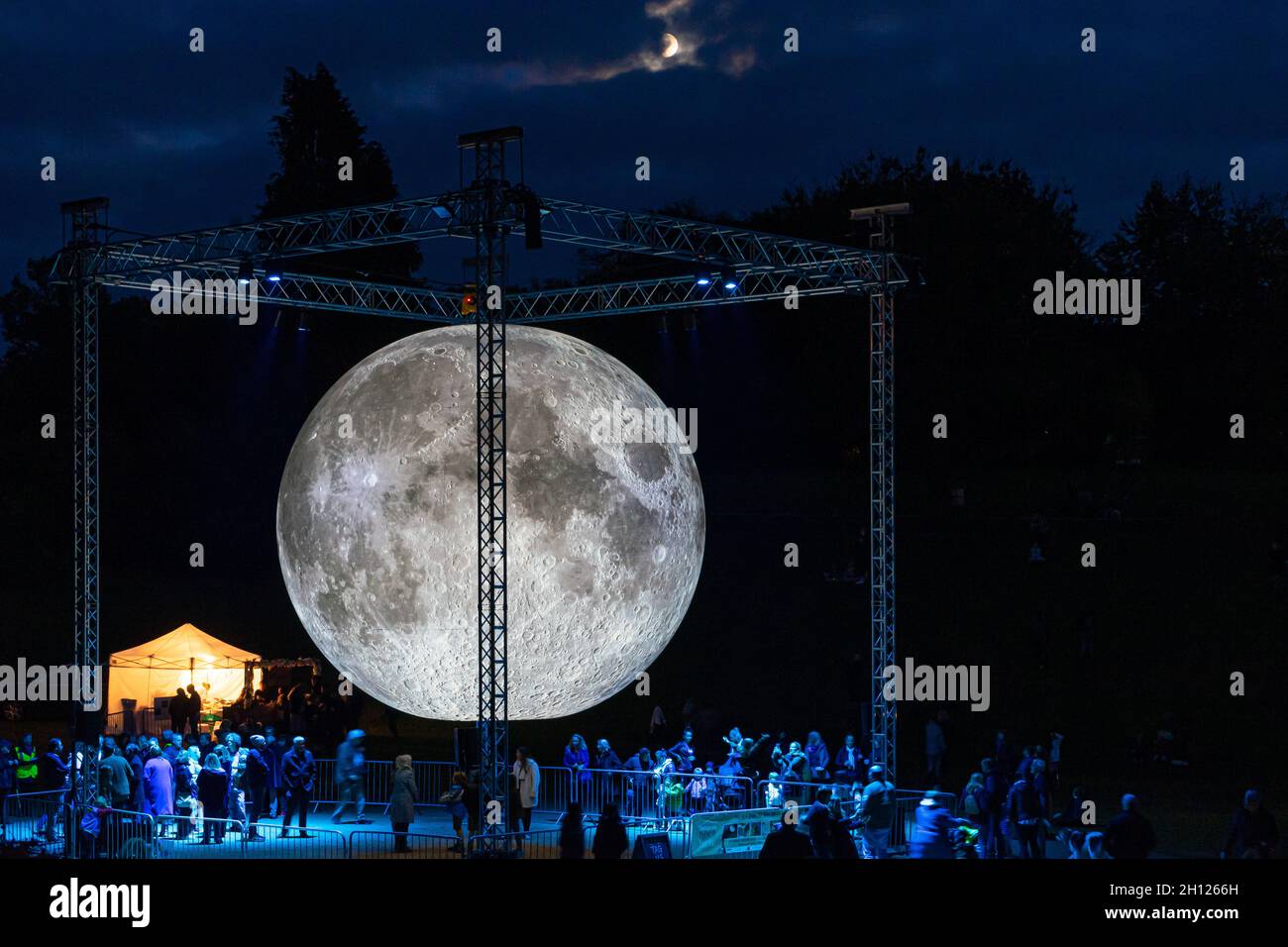Tunbridge Wells, Kent, UK. 15 October 2021. The awe inspiring Museum of the Moon light installation of the moon by UK artist Luke Jerram has landed in Claverley Grounds, Tunbridge Wells,©Sarah Mott / Alamy Live News Stock Photo