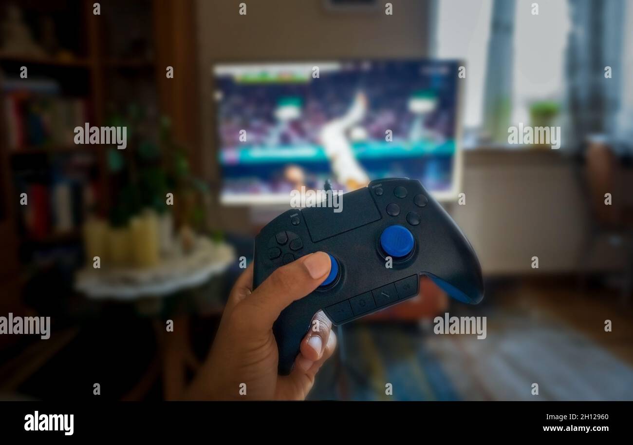 Hand holding video game controller hi-res stock photography and images ...