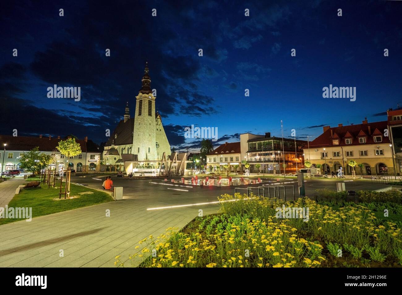 Limanowa, Poland : Panorama City center main square night view with a famous church and building cityscape a unit of local government powiat in Lesser Stock Photo